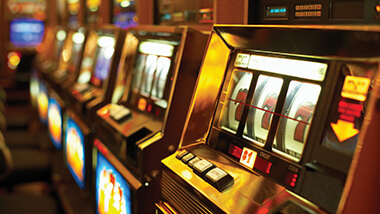 Close up of slot machines with a lucky win on the closest win.