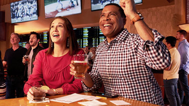 couple placing sports bets