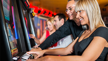 Woman enjoying herself playing slots