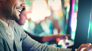 close up of man at slot machine