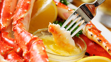 dipping crab legs in butter